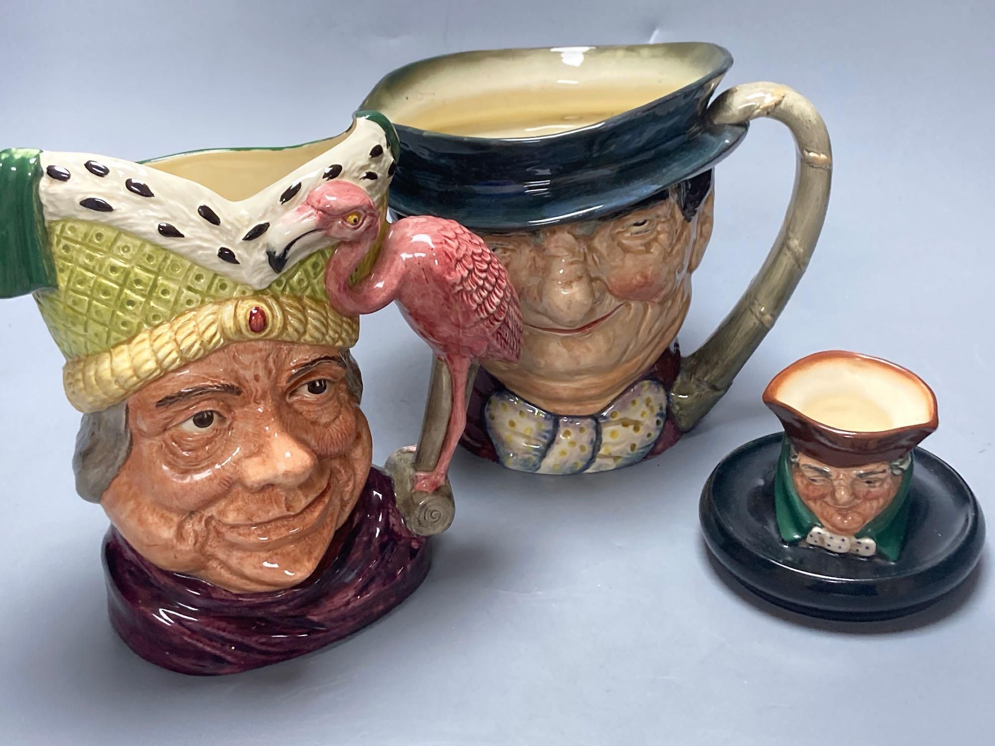 A Royal Doulton Ugly Duchess character jug, Royal Doulton Tony Weller musical character jug and Royal Doulton Old Charley ashtray